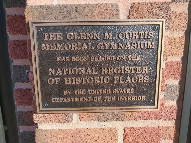 National Register of Historic Places plaque for the Glenn M. Curtis Memorial Gymnasium. Click for full size. National Register of Historic Places plaque for the Glenn M. Curtis Memorial Gymnasium image. Click for full size.
