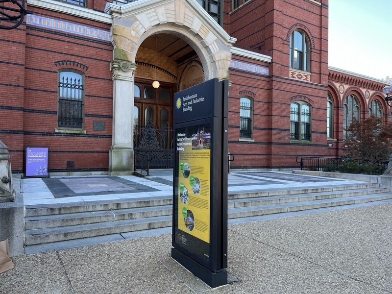 Welcome to the Smithsonian's Arts + Industries Building Marker in front of the building. Click for full size. Welcome to the Smithsonian's Arts + Industries Building Marker in front of the building image. Click for full size.