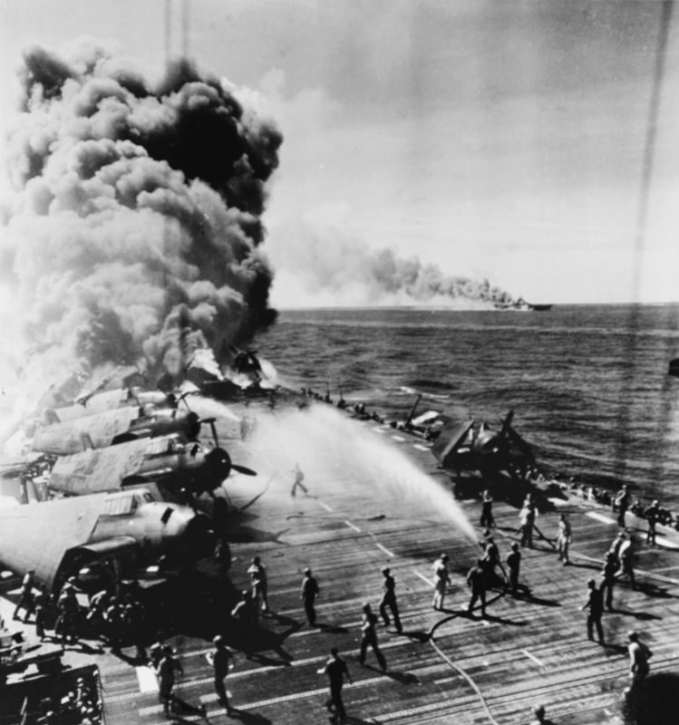 Crewmen fighting fires aboard USS <i>Belleau Wood </i> image. Click for full size.