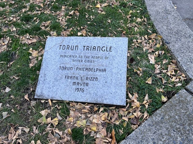 Dedication plaque at the base of the sculpture image. Click for full size.
