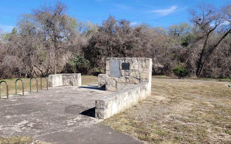 The view of the Mission San Francisco de la Espada Dam, Ditch and Aqueduct Marker from the sidewalk image. Click for full size.