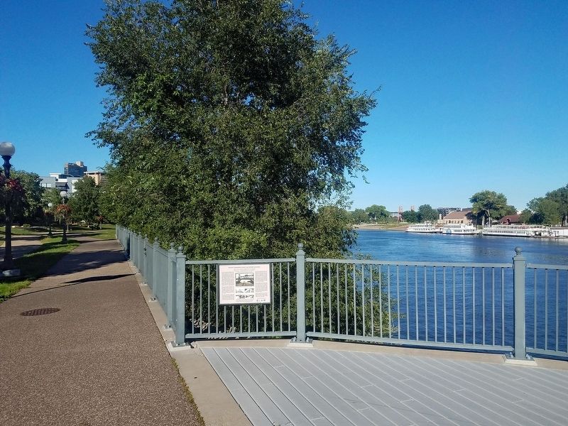 Marker at an overlook with Harriet Island and the Wigington Pavilion visible just downstream image. Click for full size.