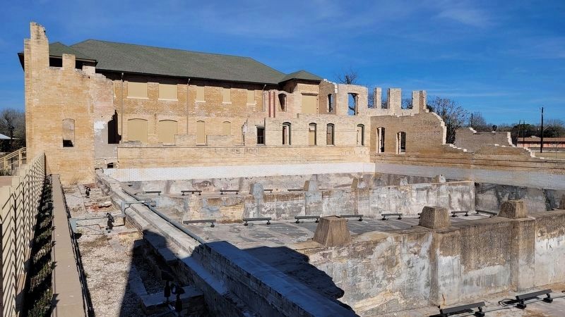 The view of the ladies pool in ruins (see writing on the far wall) image. Click for full size.
