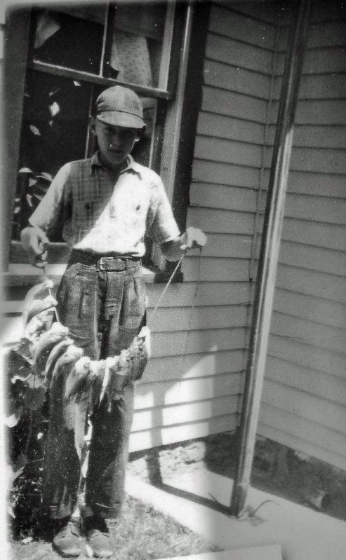 Marker detail: Ted DeYoung with catch � 1940 image. Click for full size.
