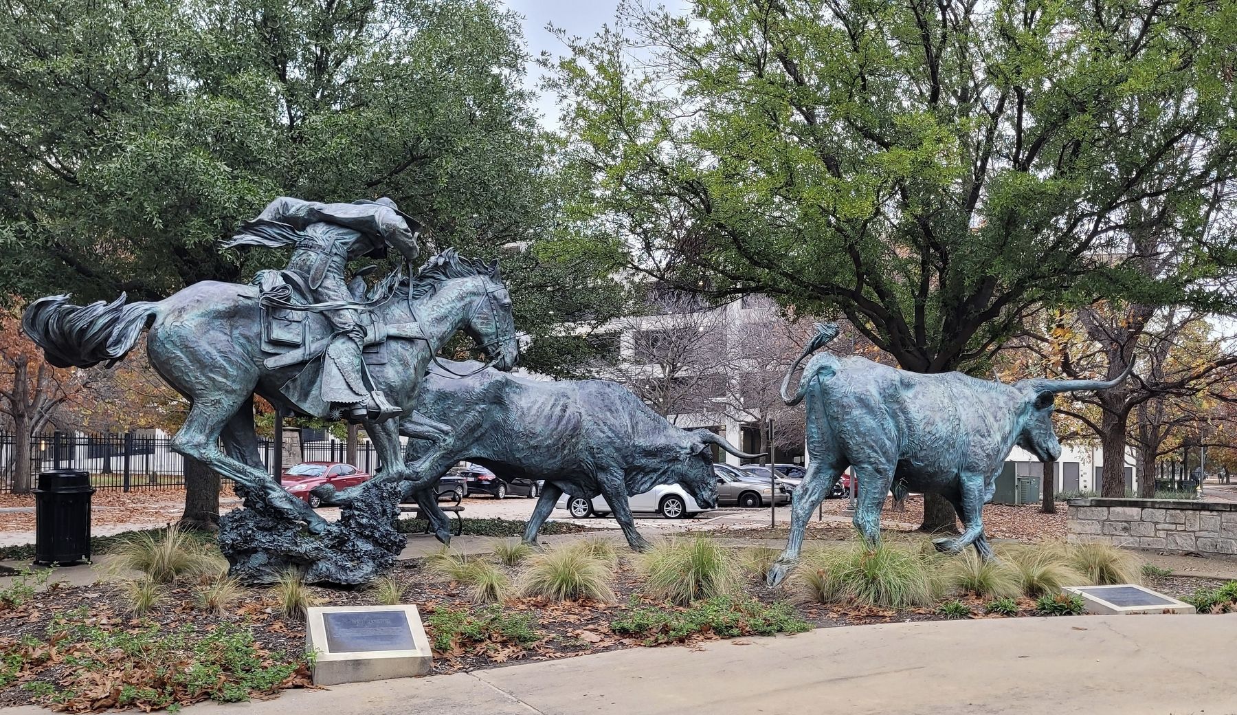 A Texas Longhorn being chased by a Vaquero statue image. Click for full size.