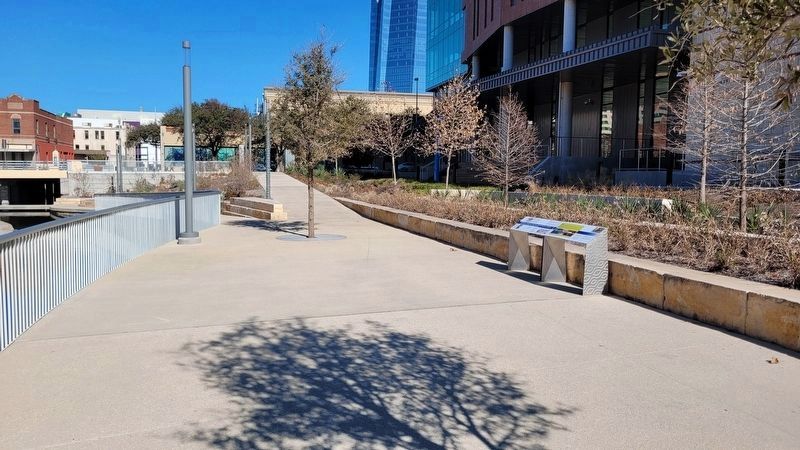 The view of the markers from the creek trail along the park looking north image. Click for full size.
