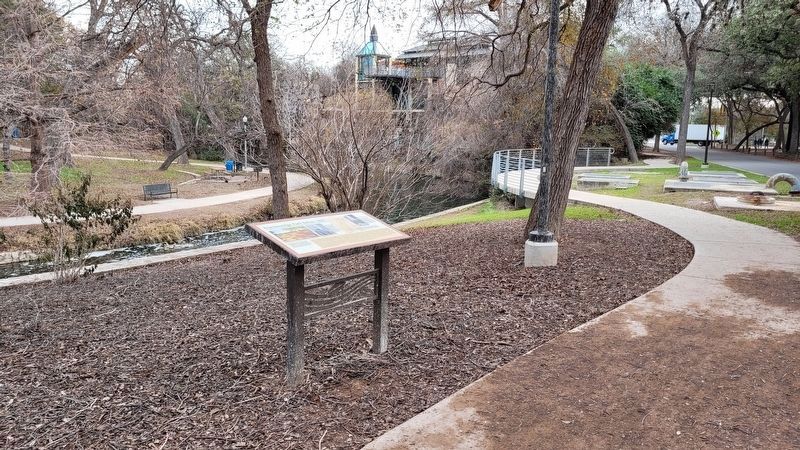 The view of the Brackenridge Park Before 1899 Marker along the trail and next to the river image. Click for full size.