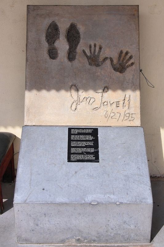 Jim Lovell hand and footprints image. Click for full size.