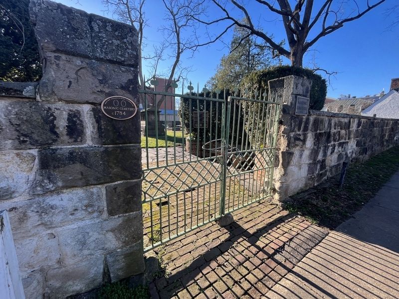 The Masonic Cemetery with the plaque visible inside the fencing image. Click for full size.