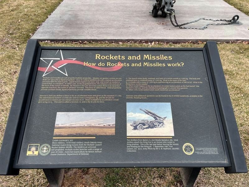 Adjacent sign explaining the science behind rockets and missiles image. Click for full size.