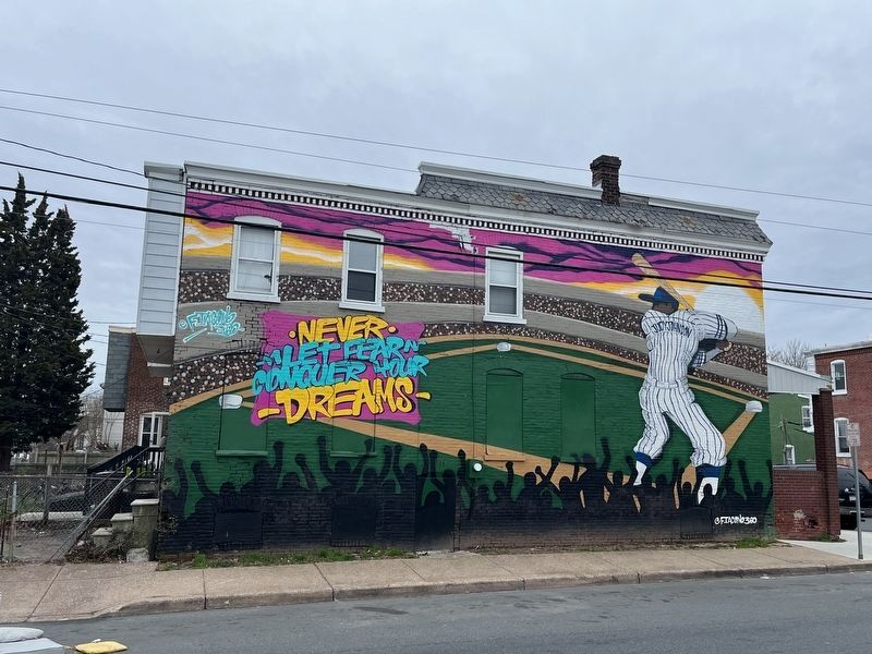 Mural across the street from the marker featuring William "Judy" Johnson image. Click for full size.