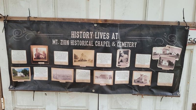 History banner on the front door of the church image. Click for full size.