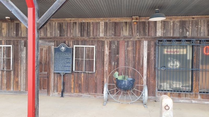 The Site of Norman Springs & Norman Grove Marker on the front porch to the boot store image. Click for full size.