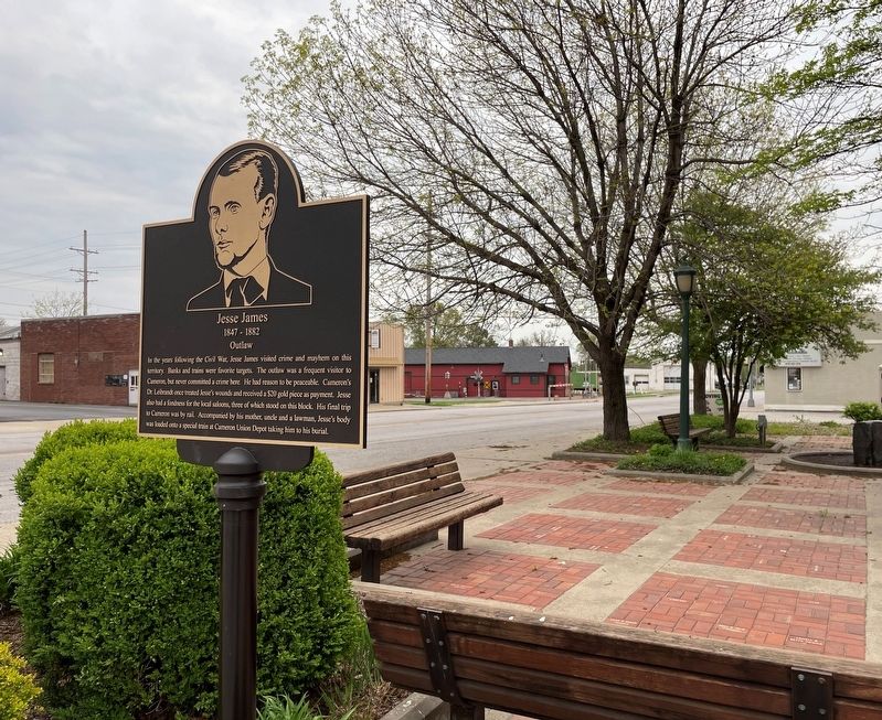 Jesse James historic marker with the Depot Museum in the background image. Click for full size.