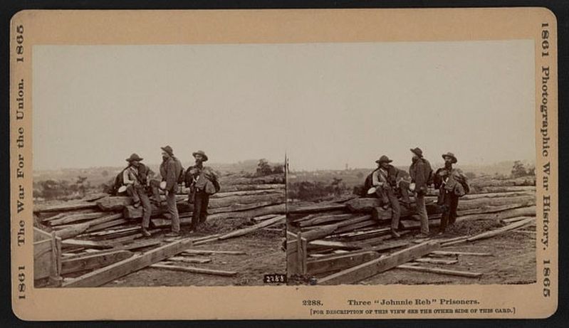This photograph of the three Confederate prisoners image. Click for full size.