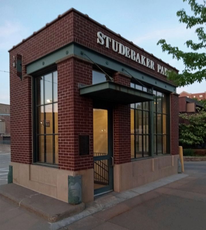 Studebaker Park Marker to the left of the door of the parking lot staircase image. Click for full size.