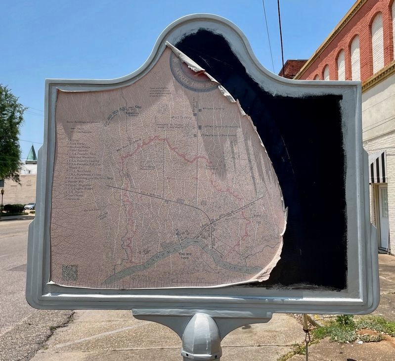 Reverse side of marker showing weathering of foil period map. image. Click for full size.