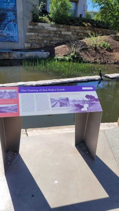 The view of the The Taming of San Pedro Creek Marker along the creek. Click for full size. The view of the The Taming of San Pedro Creek Marker along the creek image. Click for full size.
