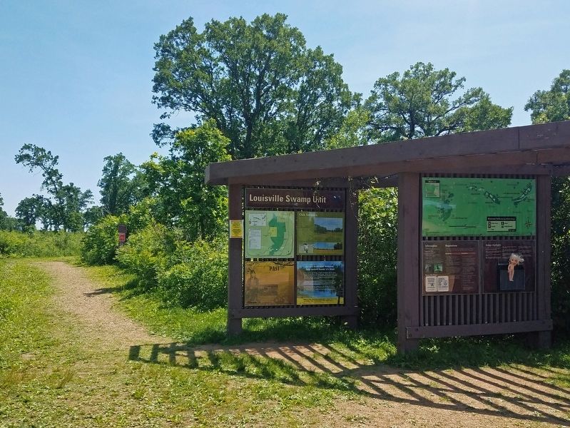 Echoes of the Past marker on the lower left of the rear panel at the Louisville Swamp trailhead. Click for full size. Echoes of the Past marker on the lower left of the rear panel at the Louisville Swamp trailhead image. Click for full size.