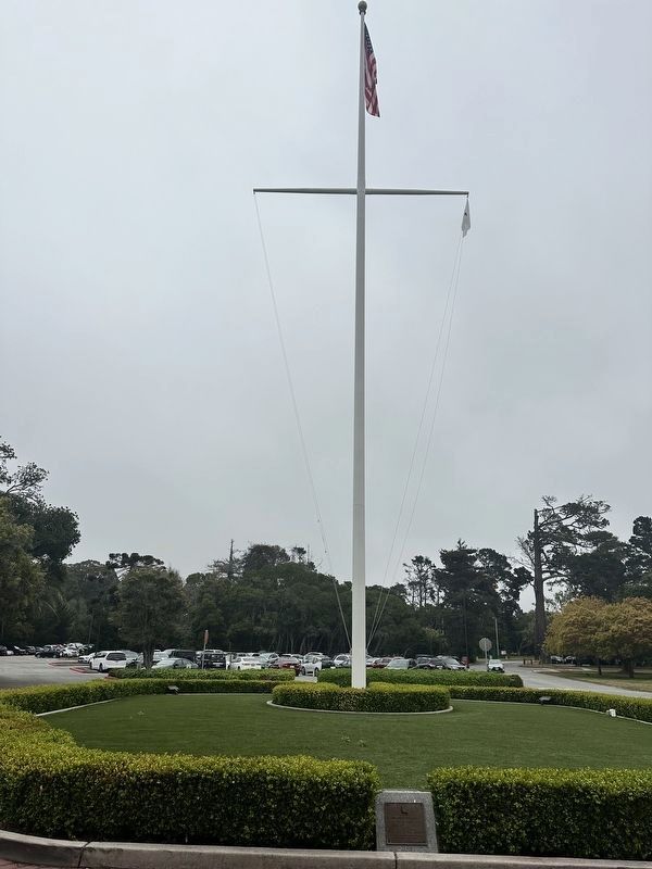 US flag flies on Sloat Circle, in front of Naval Postgraduate School's HQ in Monterey, CA image. Click for full size.
