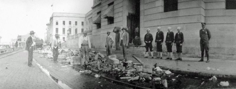 Marker detail: U.S. Revenue Agents supervise the destruction of 600 cases of illegal whiskey, c.1925 image. Click for full size.
