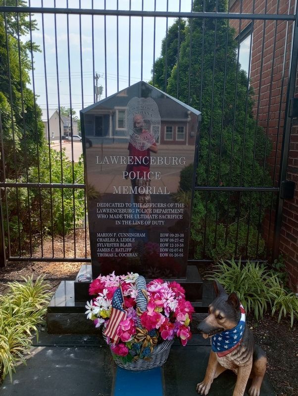 The Lawrenceburg Police Memorial stands nearby image. Click for full size.