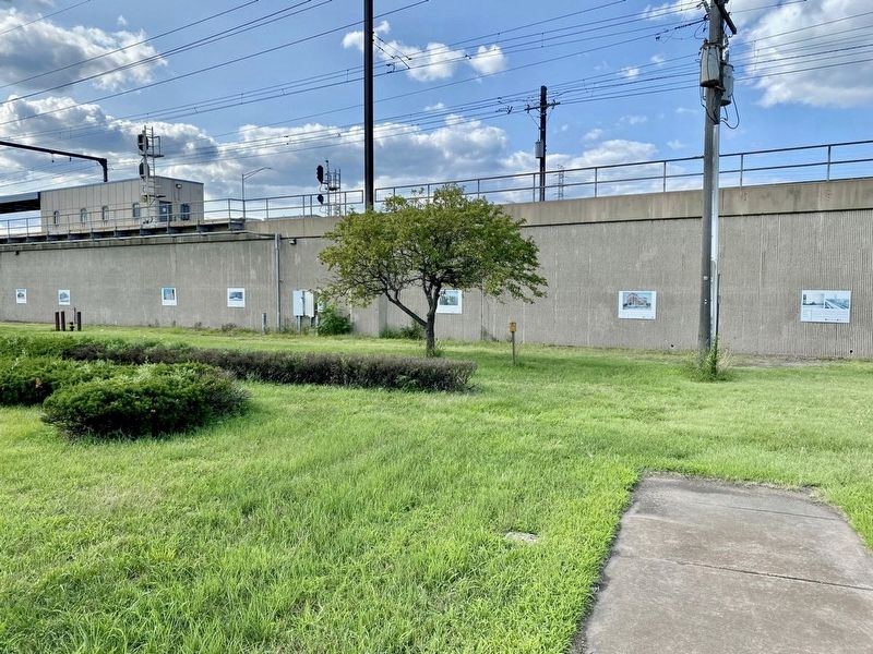 Marker located with several others on the South Shore Line retaining wall image. Click for full size.