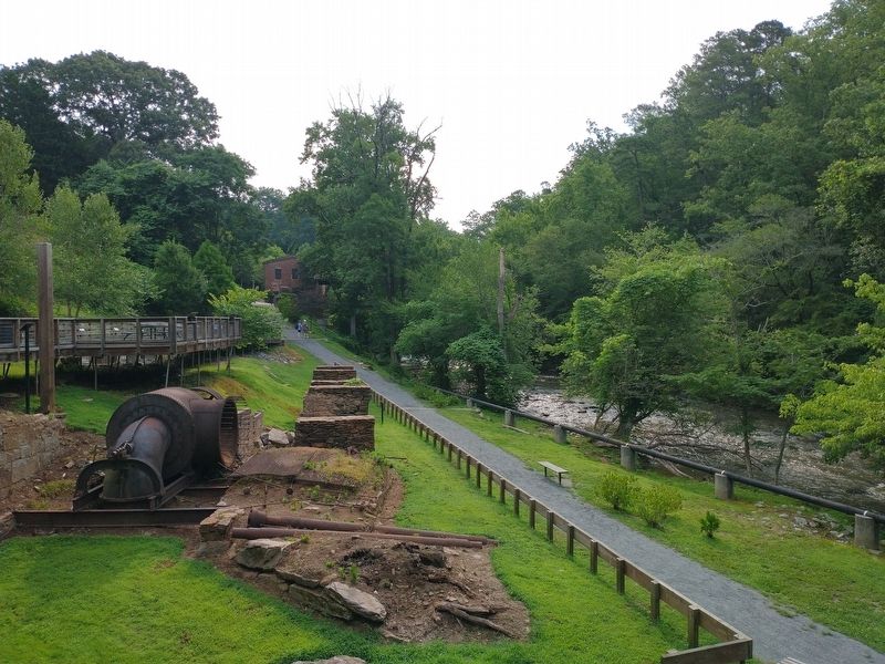 Remnants of the Mill, Vickery Creek, and the 1854 Machine Shop (background). Click for full size. Remnants of the Mill, Vickery Creek, and the 1854 Machine Shop (background) image. Click for full size.