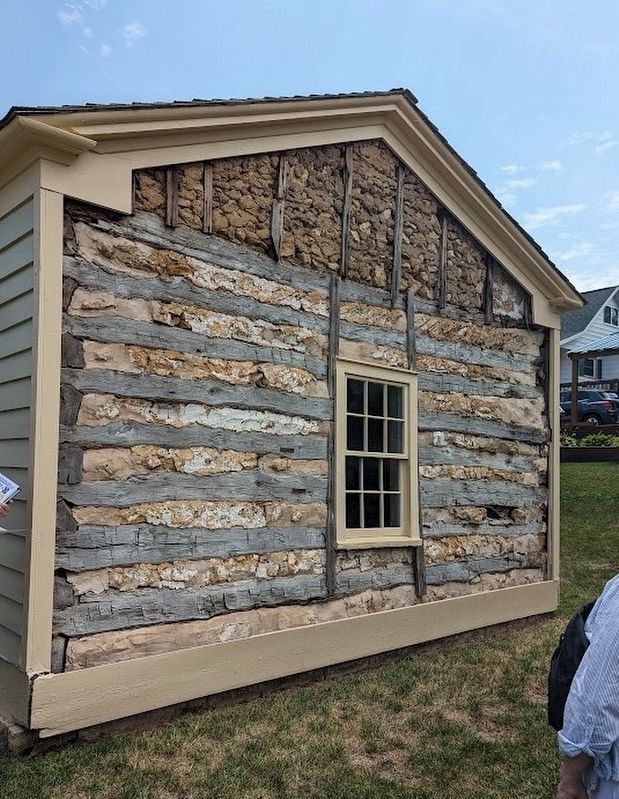 The cabin's construction method is exposed along the western wall of the cabin.. Click for full size. The cabin's construction method is exposed along the western wall of the cabin. image. Click for full size.