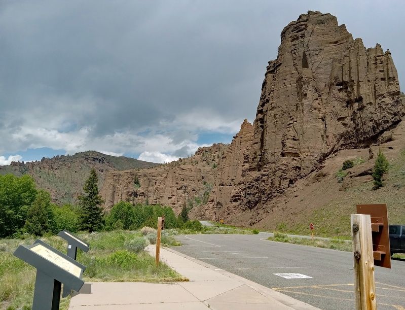 View looking west at the marker (foreground) and wayside along the North Fork Highway. Click for full size. View looking west at the marker (foreground) and wayside along the North Fork Highway image. Click for full size.