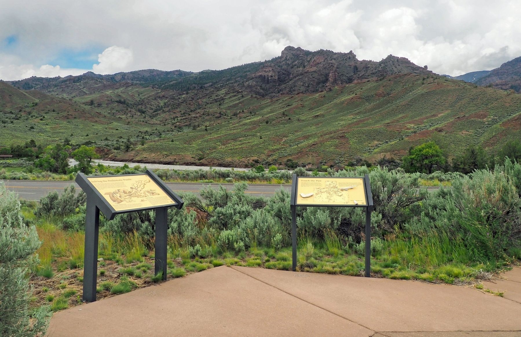 Solving the Prehistoric Puzzle marker (left) at a wayside overlooking the Shoshone Canyon image. Click for full size.