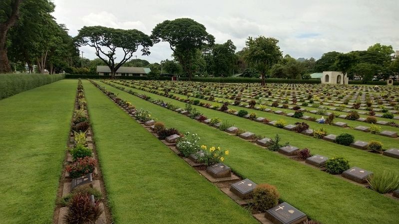 Rows of Graves Immediately to the Left of the Entrance Gate. Click for full size. Rows of Graves Immediately to the Left of the Entrance Gate image. Click for full size.