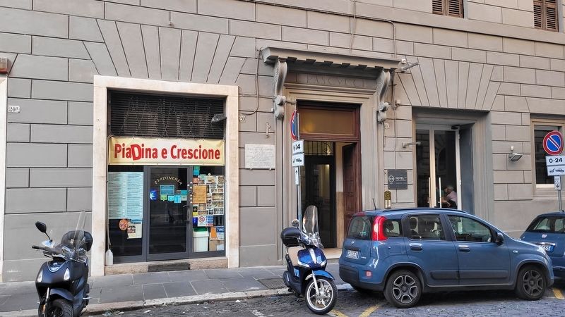 The Manlio Gelsomini Marker is located to the left of the entrance to the building. Click for full size. The Manlio Gelsomini Marker is located to the left of the entrance to the building image. Click for full size.