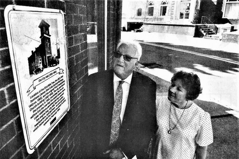 Beckley Mayor Rob Rappold (l) and Historical Society Secretary Becky Leach admire the new plaque. image. Click for full size.