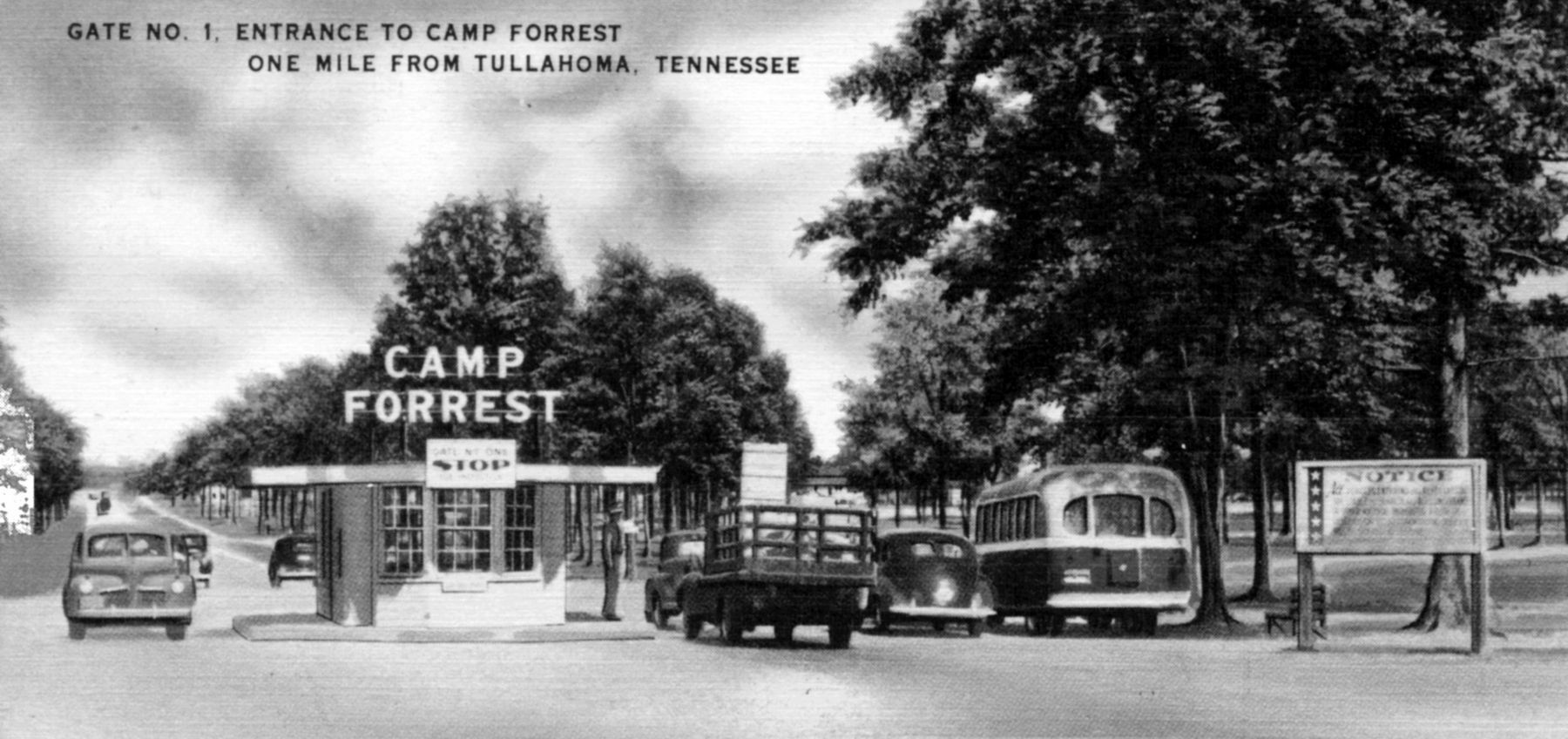 Cars pass through the entrance to what was Camp Forrest. image. Click for full size.