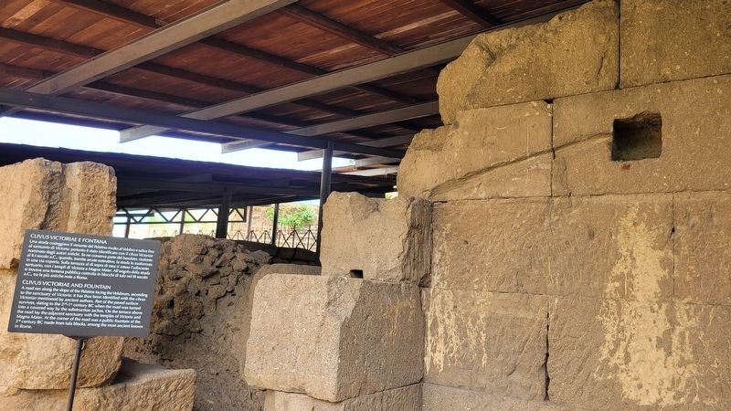 The covered ruins of the Clivus Victoriae and Fountain and Marker. Click for full size. The covered ruins of the Clivus Victoriae and Fountain and Marker image. Click for full size.
