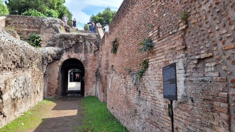 The view of the Neronian Cryptoporticus Marker and the south entrance to the tunnel image. Click for full size.