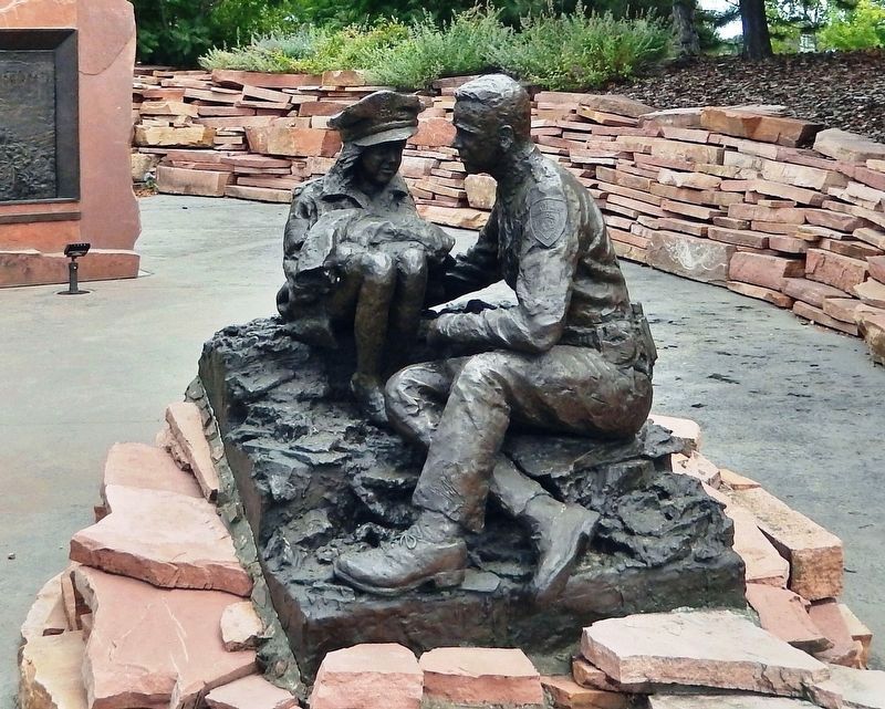 Police Officer with Child (<i>sculpture</i>). Click for full size. Police Officer with Child (<i>sculpture</i>) image. Click for full size.