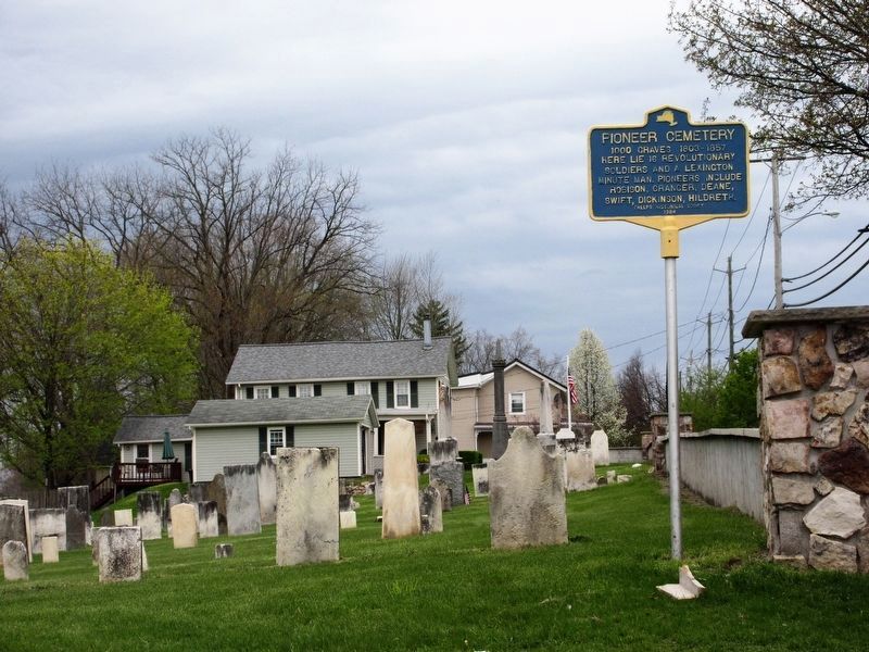 Pioneer Cemetery Marker and partial view of cemetery image. Click for full size.
