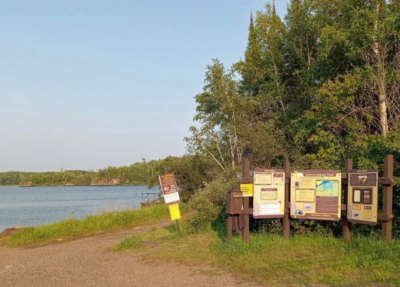 History of Saganaga Lake Marker (right) at a public boat launch on Saganaga Lake image. Click for full size.
