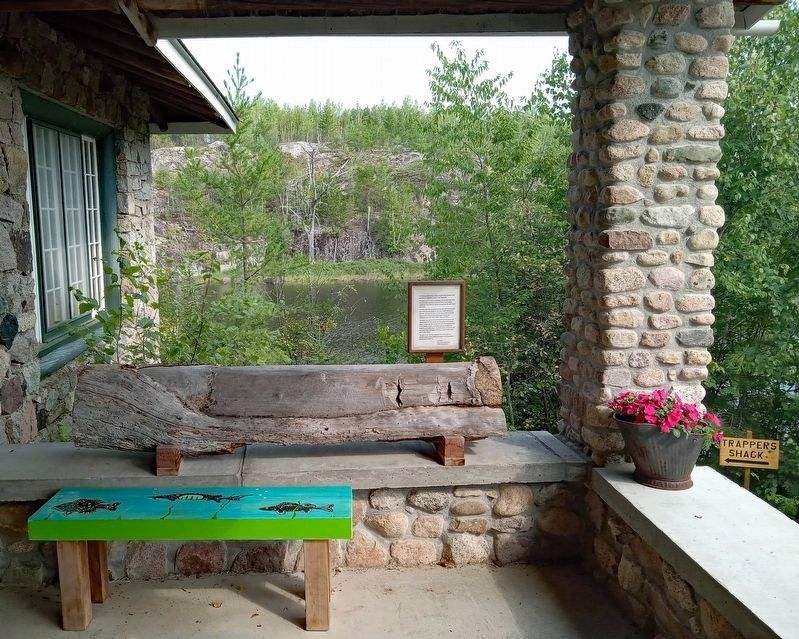 Marker and log on the porch of the Chik-Wauk Museum. Click for full size. Marker and log on the porch of the Chik-Wauk Museum image. Click for full size.