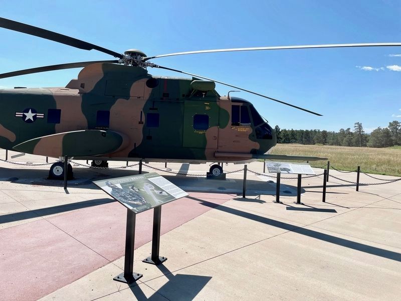 "That Others May Live" Marker close to HH-3E Jolly Green Giant helicopter image. Click for full size.