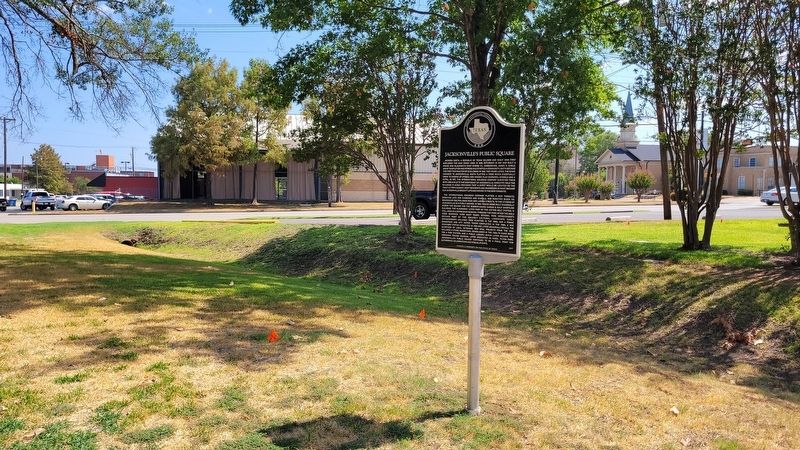 The Jacksonville's Public Square Marker with the ditch from the old train tracks image. Click for full size.