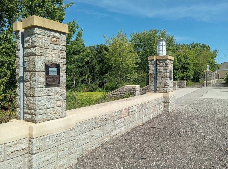 Marker (left) on the Saint Paul Downtown Airport floodwall. Click for full size. Marker (left) on the Saint Paul Downtown Airport floodwall image. Click for full size.