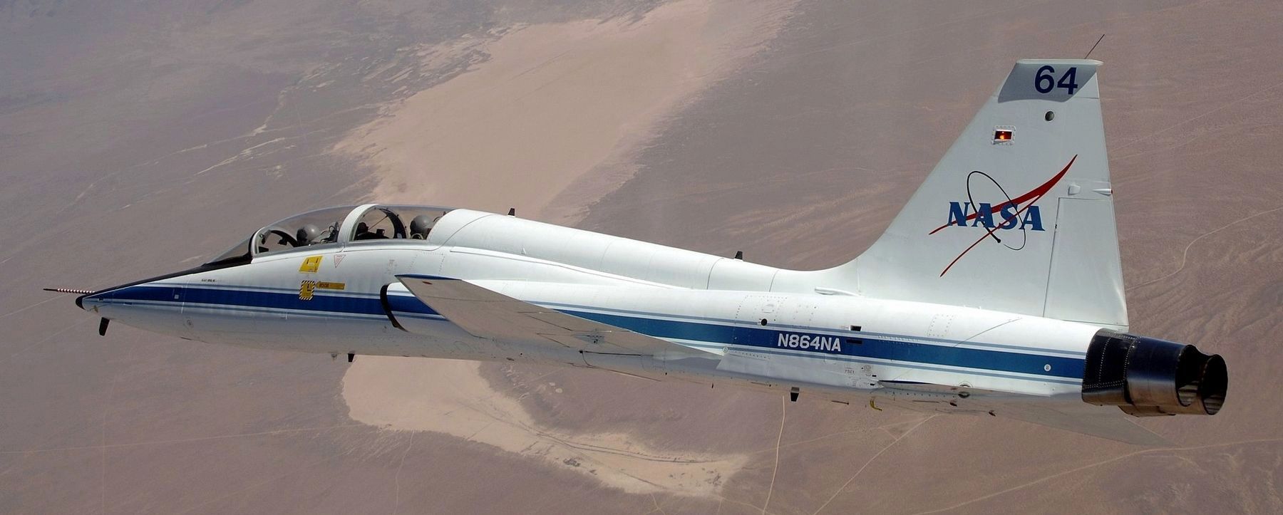 NASA Dryden's T-38 trainer aircraft in flight over Cuddeback Dry Lake in Southern California. image. Click for full size.