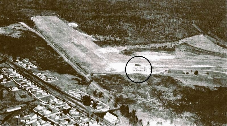 Undated low oblique aerial of airport with hangar circled. Courtesy Dan Sessler. image. Click for full size.