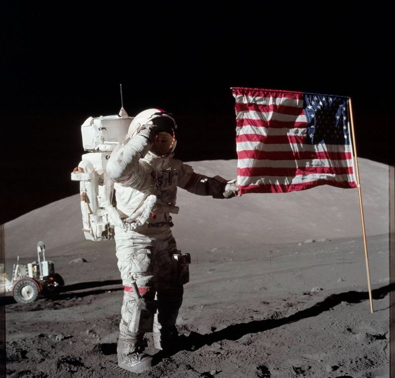 Cernan salutes the flag on the moon image. Click for full size.