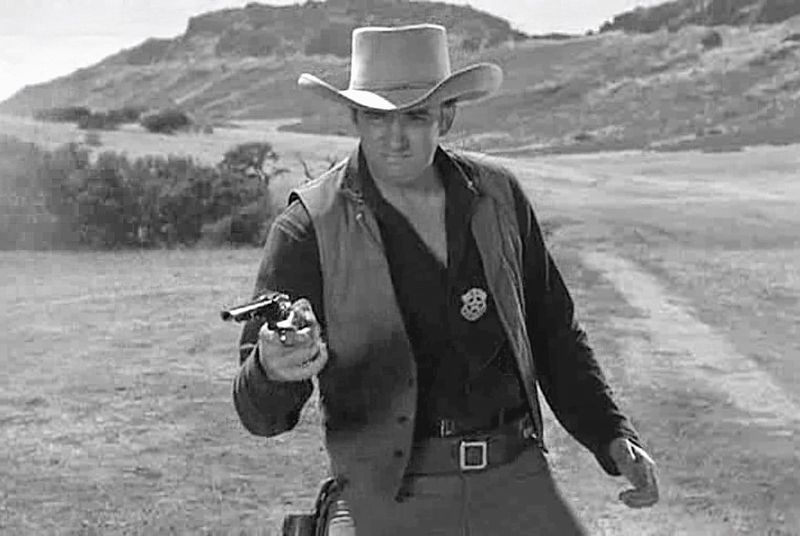 Gunsmoke with Wildwood Mesa in background. Click for full size. Gunsmoke with Wildwood Mesa in background image. Click for full size.