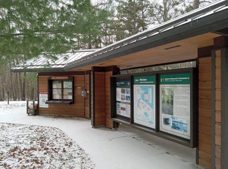 Marker (right) at the Mille Lacs Kathio State Park visitor contact station image. Click for full size.