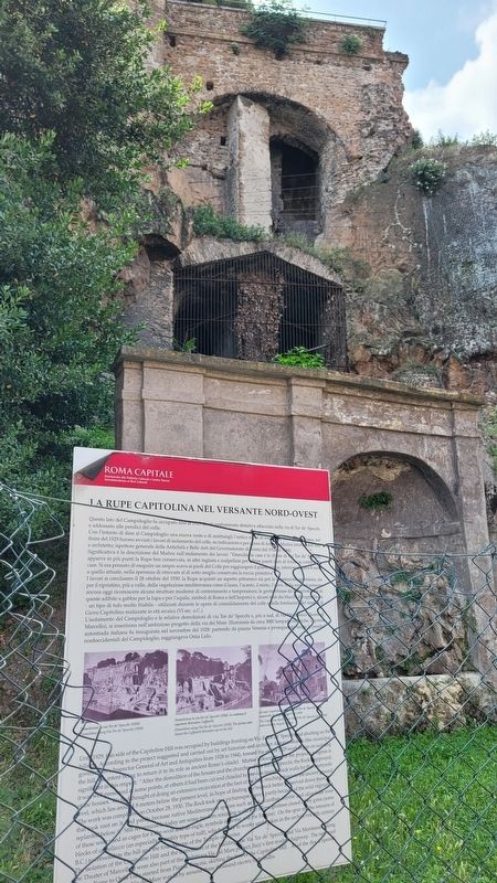 The view of the Capitoline Rock on the North-West Side Marker behind the fence image. Click for full size.